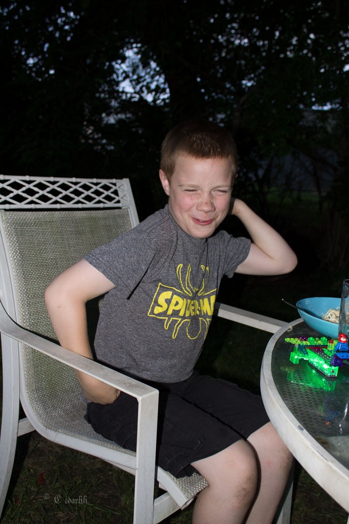 My son after his meal, showing how he feels. Muscles? Maybe in time...